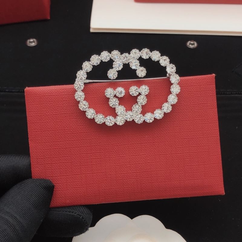 Gvc*1 brooches